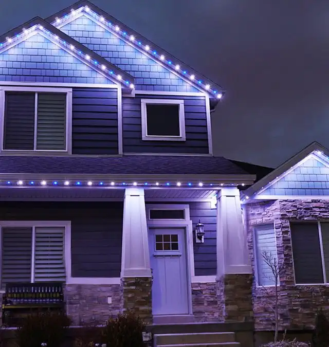 Permanent white and purple roofline lighting on a home